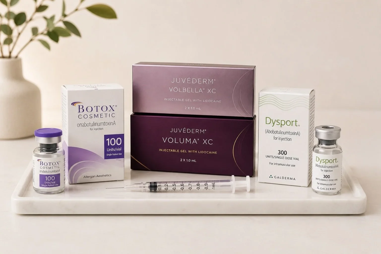 Botox Cosmetic, Juvéderm Volbella, Juvéderm Voluma and Dysport on a marble tray